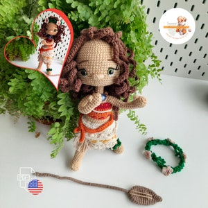 May include: A handmade crochet doll of a character with brown curly hair, wearing a white and orange outfit. The doll has a green flower crown and a brown spear. A smaller image of the doll is in the background.