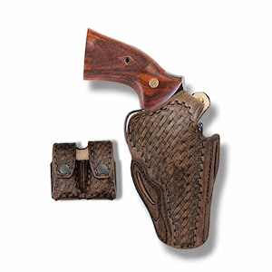 May include: A brown leather holster with a matching magazine pouch. The holster features a woven pattern and decorative stitching. The revolver has a wooden grip. The set is designed for carrying a firearm.