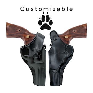 May include: Two black leather gun holsters with a paw print design, displayed with two revolvers. The revolvers have wooden grips. The word "Customizable" is above the holsters.