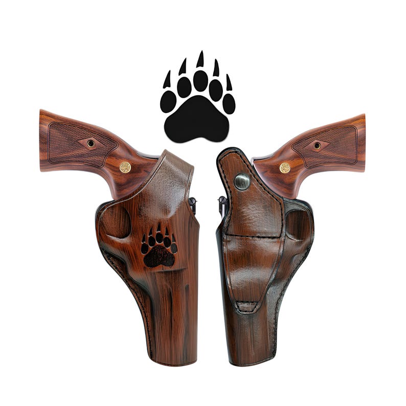 May include: Two brown leather holsters with a bear paw design. The holsters are designed to fit a revolver.
