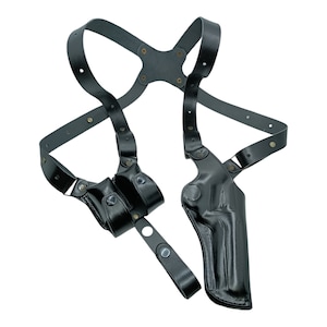 May include: Black leather shoulder holster with a dual magazine pouch and a molded pistol holster. The straps are adjustable and secured with metal rivets and snaps. The holster is designed to be worn under clothing.