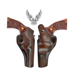 May include: A brown leather holster for a revolver with a wood grain pattern. The holster has an eagle design embossed on the side.