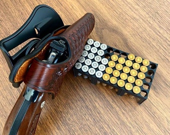 Fondina in pelle con attacco a paletta: Taurus modelli 856, 82, 85, 605, OWB a due posizioni con estrazione incrociata e chiusura a scatto.