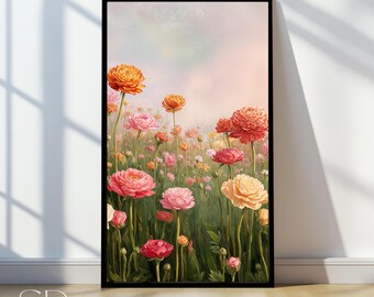 May include: A framed floral print featuring a field of colorful flowers in shades of pink, orange, and yellow. The artwork has a soft, watercolor style with a dreamy, pastel background. The print is in a black frame and is displayed on a wooden floor.