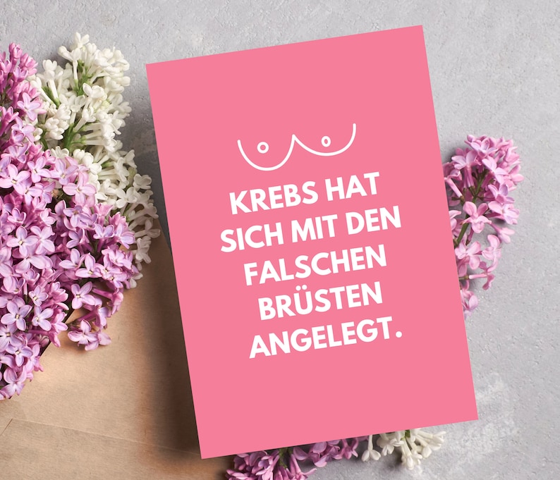 Pode incluir: Cart&atilde;o rosa com um contorno branco de um seio e o texto "Krebs hat sich mit den falschen Br&uuml;sten angelegt."