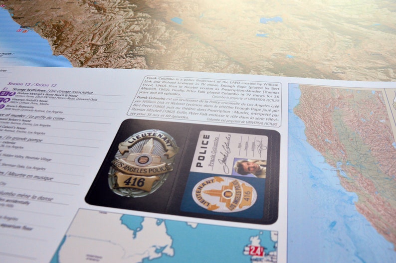 May include: A close-up of a police badge and identification card. The badge is a gold-colored metal badge with the words "Los Angeles Police" and the number "416" on it. The identification card is a blue card with the words "Police" and "Frank Columbo" on it. The card also has a picture of a man in a suit.