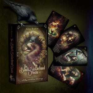 May include: A tarot card deck titled "The Black Sisterhood Oracle" with a raven. The box shows a woman in a dress. Several cards are displayed, each with mystical illustrations and numbers. The deck contains 52 cards.