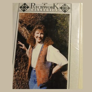 May include: The cover of a book titled "The Patchwork Collection" features a woman wearing a patchwork vest over a white blouse and blue jeans. The vest has a brown and blue design. The woman is smiling and standing near a rock wall.