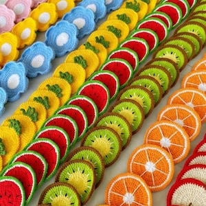 May include: A collection of colorful, crocheted coasters in various fruit and flower designs. The coasters include watermelon, kiwi, orange slices, and flower shapes in pink, yellow, and blue. These handmade items are perfect for adding a touch of whimsy to any home.