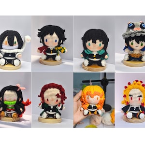 May include: A collection of eight crocheted anime character dolls. Each doll features detailed yarn work, with distinct hairstyles, clothing, and accessories. The dolls are displayed on small wooden bases, showcasing a variety of colors and designs.