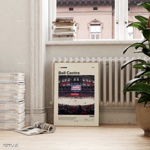 May include: A framed poster featuring the Bell Centre, with the text "Bell Centre" at the top. The image inside shows a hockey game in progress, with a crowd of spectators. The poster includes the text "Montreal, QC" and the year "1996".