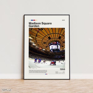 May include: A framed poster featuring a hockey game at Madison Square Garden. The poster includes the text "Madison Square Garden" and "1968". The image shows players in blue and red uniforms on the ice, with the arena's ceiling visible.