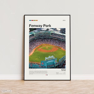 May include: A framed print of Fenway Park, a baseball stadium in Boston, Massachusetts. The image shows an aerial view of the field, with the text "Fenway Park" and "1912" displayed. The print has a black frame and is displayed on a wooden floor.