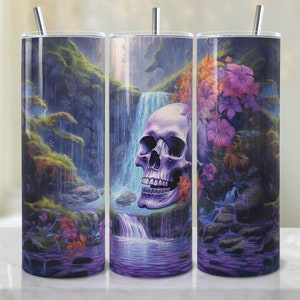 May include: A purple and blue watercolor-style design of a skull with flowers and a waterfall on a stainless steel tumbler.