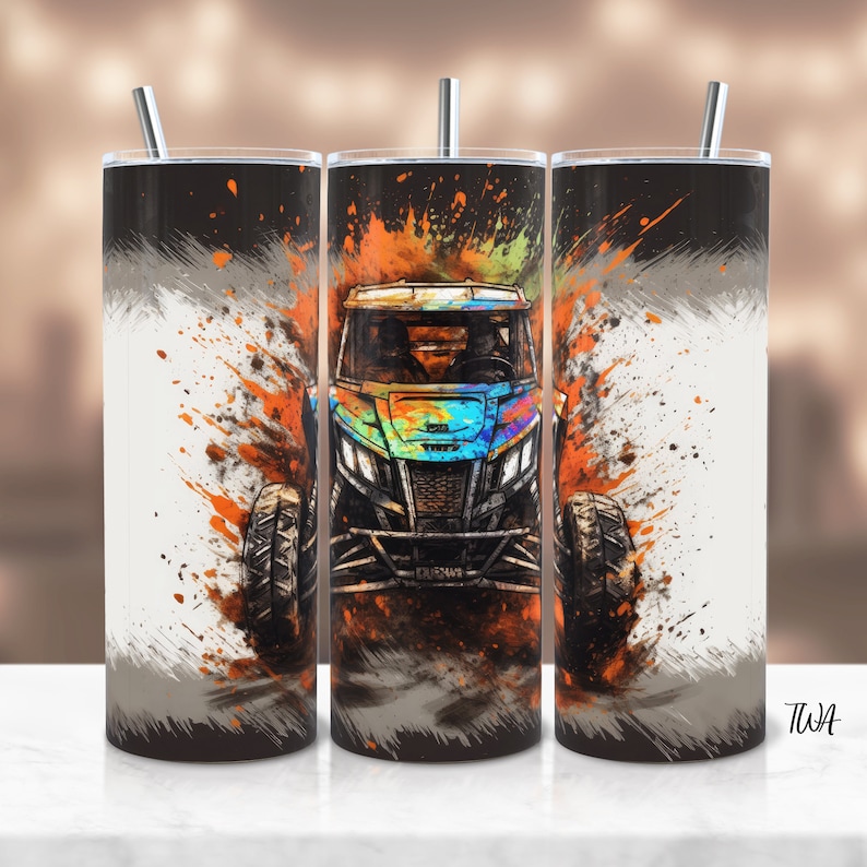May include: A black and white tumbler featuring a colourful graphic of an off-road vehicle driving through a splash of orange and yellow paint.