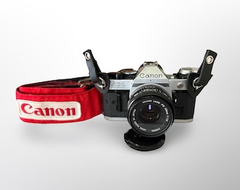 Cámara de cine Canon AE-1 Program de 35 mm, modelo clásico, con objetivo de 50 mm f/1.8, revisada y lista para usar.