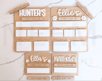 May include: A set of four wooden signs with white lettering. Each sign has a different name, "Hunter's", "Ellie's", "Ella's", and "Matthew's". The signs are designed for a child's first and last day of school or daycare. Each sign has spaces for the child's date, age, height, what they want to be when they grow up, and things they love.