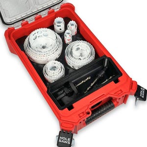 May include: A red tool case with a clear lid, filled with various sizes of white hole saws. The case also contains drill bits and a black handle. The words "HOLE SAWS" are printed on the latches.