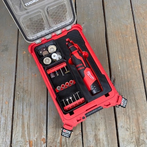 May include: Red and black Milwaukee M12 Rotary Tool kit, open to display the tool and various attachments. The kit includes a rotary tool, grinding wheels, and other accessories, all neatly organized within the case.