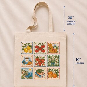 May include: A beige cotton tote bag featuring a grid of nine colorful illustrations including lemons, tomatoes, bread, coffee, strawberries, flowers, a coastal scene, books, and oranges. Dimensions are 15 inches wide, 16 inches long, with 20-inch handles.