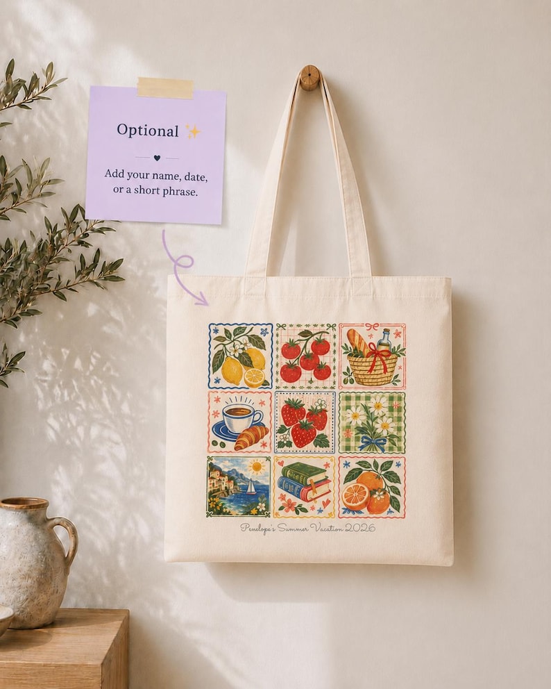May include: A cream-colored canvas tote bag featuring a grid of nine colorful illustrations including lemons, tomatoes, a picnic basket, coffee, strawberries, flowers, a coastal scene, books, and oranges, with the text Penelope's Summer Vacation 2026.