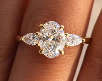 Oval Cut Moissanite Engagement Ring, Pear Side Stones, 14K Yellow Gold Trilogy Ring