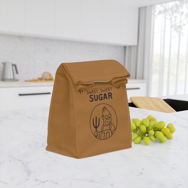 May include: A brown lunch bag with a cartoon character holding a fork and the text "Sweet Sweet Sugar".