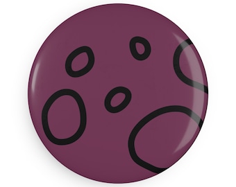 May include: A round, burgundy button with a glossy finish. The button features a simple design of black, irregular circular shapes, creating a playful, abstract pattern. This accessory is suitable for various uses, such as decorating clothing or bags.