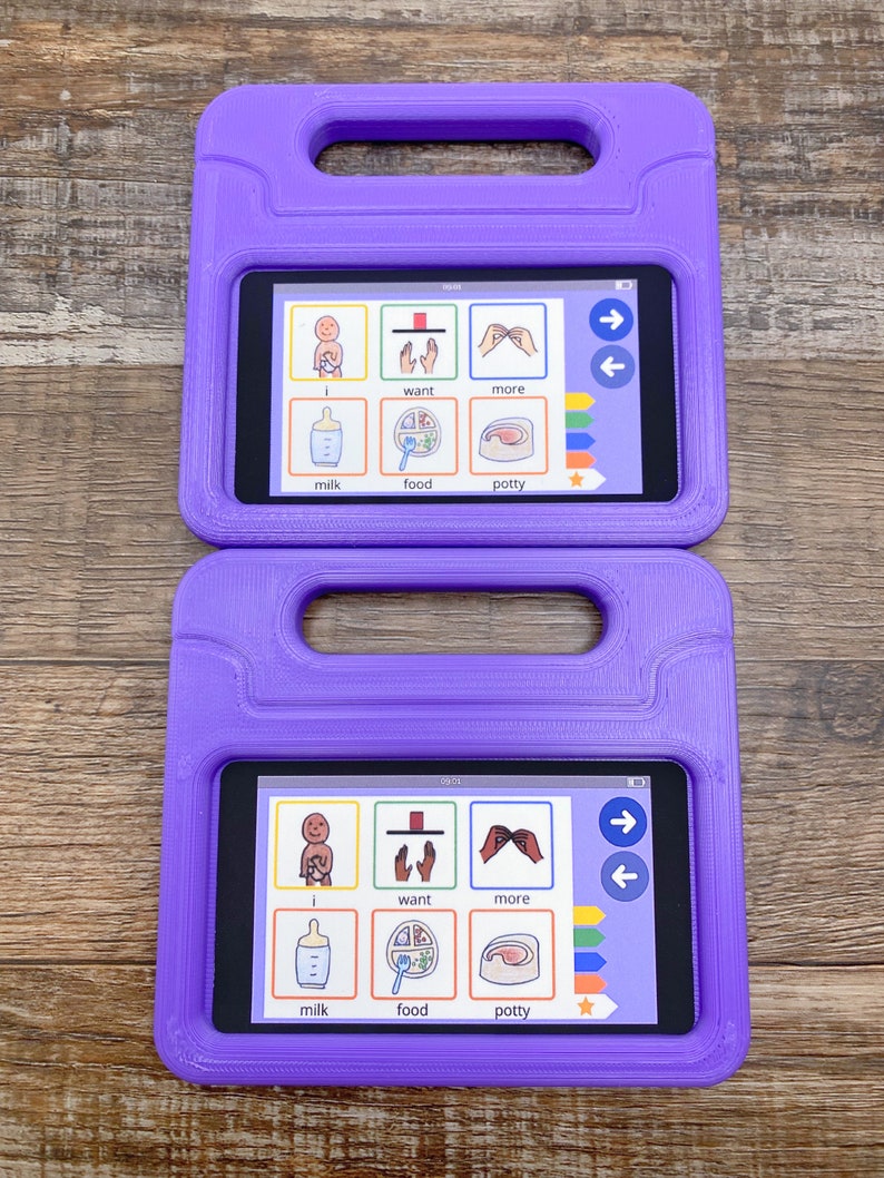 May include: Two purple rectangular protective cases with integrated handles, each housing a tablet displaying a communication interface. The screen shows six icons labeled i, want, more, milk, food, and potty, along with navigation arrows and color-coded tabs.