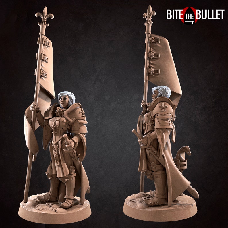 May include: A miniature figurine of a female warrior in armor holding a flag with a fleur-de-lis design. The flag is attached to a staff with a fleur-de-lis finial. The warrior is wearing a helmet and a long, flowing cloak. The figurine is painted in a brown and white color scheme. The figurine is standing on a circular base. The text "BITE THE BULLET" is visible in the background.