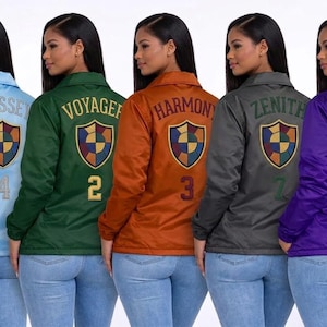 May include: Five long-sleeve button-up jackets in light blue, dark green, orange, charcoal grey, and purple. Each jacket features a shield emblem on the back with the words ODYSSEY, VOYAGER, HARMONY, ZENITH, or APEX and a corresponding number.