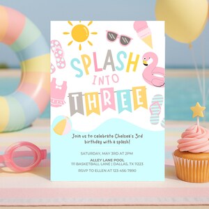 May include: A colourful birthday invitation with the words "SPLASH INTO THREE" and beach-themed illustrations. A cupcake with pink icing and a star decoration is in the foreground, with a beach scene in the background.