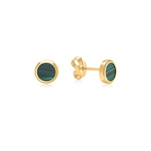May include: A pair of gold earrings with round green malachite stones.