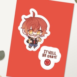 May include: A red background with two stickers. The first sticker is a cartoon illustration of a young man with red hair, wearing glasses and a black jacket. The second sticker is a white circle with the text "IT WILL BE OKAY!" in black text and a red heart.