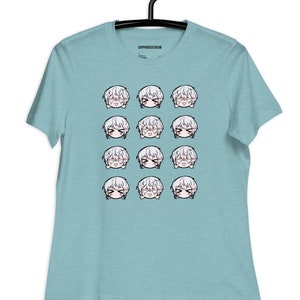 May include: A light blue t-shirt with a repeating pattern of 12 white-haired anime character faces with different expressions.