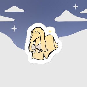 May include: A sticker featuring a cartoon illustration of a light yellow dog with a pink bow tie. The dog is standing on a white background with a light blue sky and white clouds in the background.