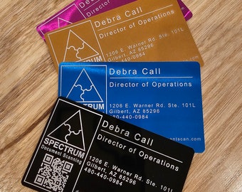 May include: A stack of business cards in various colors: magenta, gold, blue, and black. Each card features the name "Debra Call" and "Director of Operations." The black card includes a QR code and the company name "SPECTRUM Document Scanning."