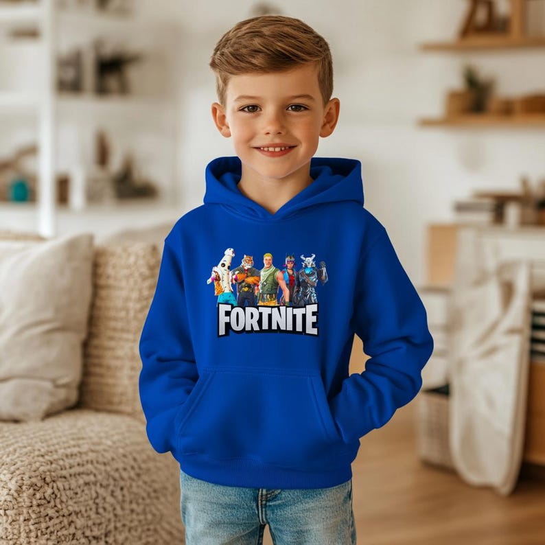 May include: A royal blue hooded sweatshirt with a Fortnite graphic. The graphic features characters and the word "FORTNITE" in white. The sweatshirt has a kangaroo pocket and a drawstring hood.