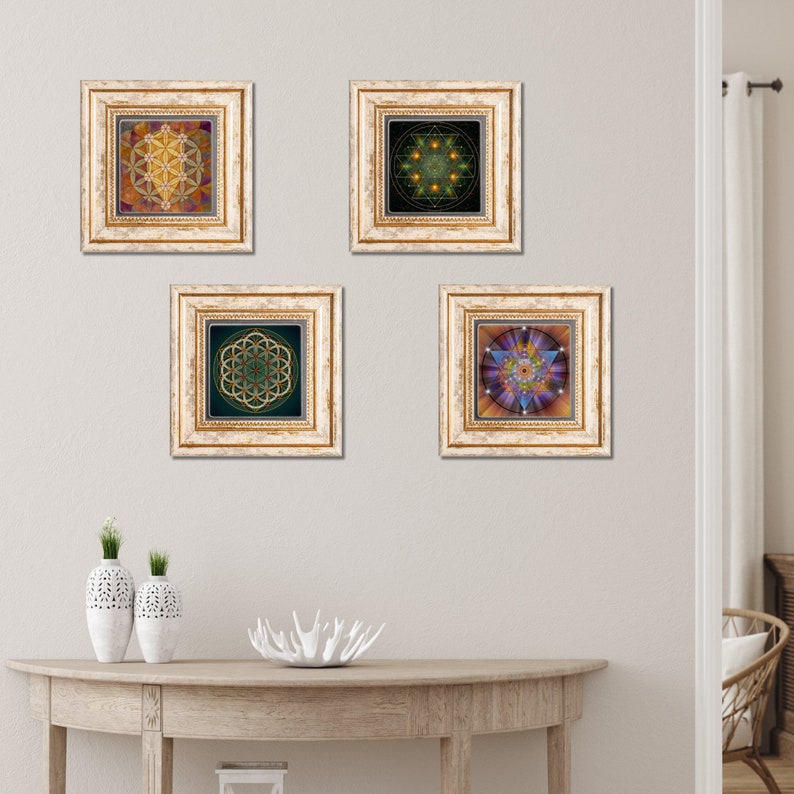 May include: Four framed prints of geometric designs in gold, green, and purple hues. The frames are white with gold accents. The prints are hanging on a white wall.