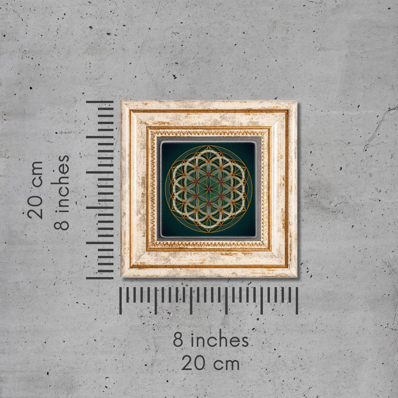 May include: A framed print of a geometric design in gold and white on a dark green background. The frame is a light wood color with a distressed finish. The print is 8 inches by 8 inches.