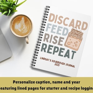 May include: A white journal with a spiral binding and the text "DISCARD FEED RISE REPEAT" in brown, blue, and gray. The journal also has the text "LINDSAY'S SOURDOUGH JOURNAL 2025".