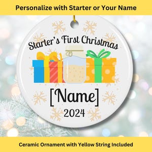 May include: White ceramic Christmas ornament with a colorful illustration of presents and a jar of homemade jam. The text "Starter's First Christmas" and "[Name] 2024" is printed on the ornament.