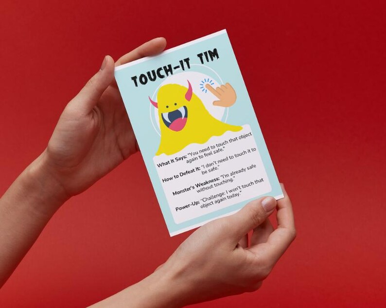 May include: A blue and yellow card with a cartoon monster on it. The card says "Touch-It Tim" and has instructions on how to defeat the monster. The monster says "You need to touch that object again to feel safe".
