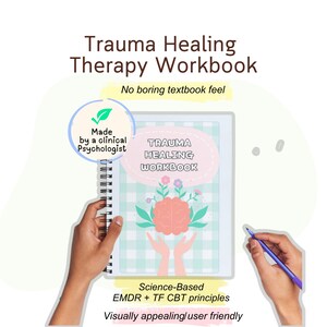 May include: A spiral-bound workbook titled "Trauma Healing Therapy Workbook." The cover features a pink oval with the title and a brain illustration with flowers. Text on the cover states "Made by a clinical Psychologist." Additional text includes "No boring textbook feel."