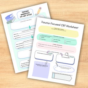 May include: Two worksheets for Trauma Focused CBT. The worksheets are white with light blue and yellow accents. One worksheet is titled "Trauma Narrative (TF-CBT STYLE)". The other is titled "Trauma Focused CBT Worksheet". Both have areas for writing and checkboxes.