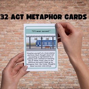 May include: A person holding a card from a set of 32 ACT Metaphor Cards. The card features an illustration of a train station platform with a train. Text on the card reads "I'll never succeed." and a description of the metaphor.
