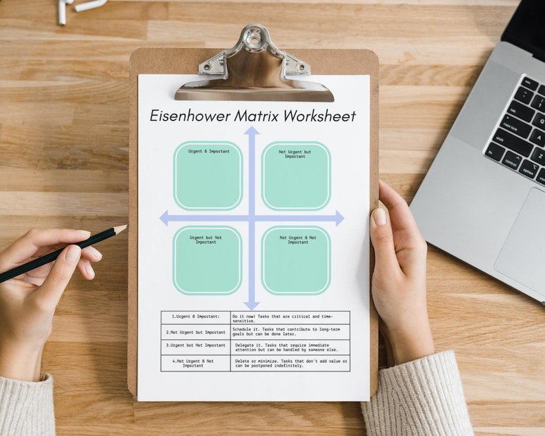 May include: A printable Eisenhower Matrix Worksheet on a clipboard. The worksheet is divided into four quadrants labeled "Urgent & Important", "Not Urgent but Important", "Urgent but Not Important", and "Not Urgent & Not Important".