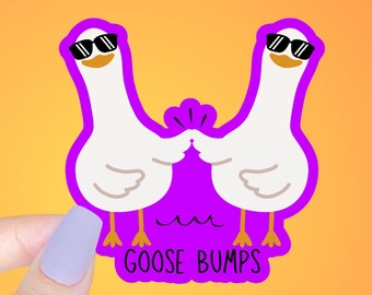 May include: A purple sticker with two cartoon geese wearing sunglasses and the text "Goose Bumps".