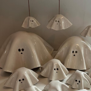 Ceramic hand-made and hand painted white Halloween ghosts