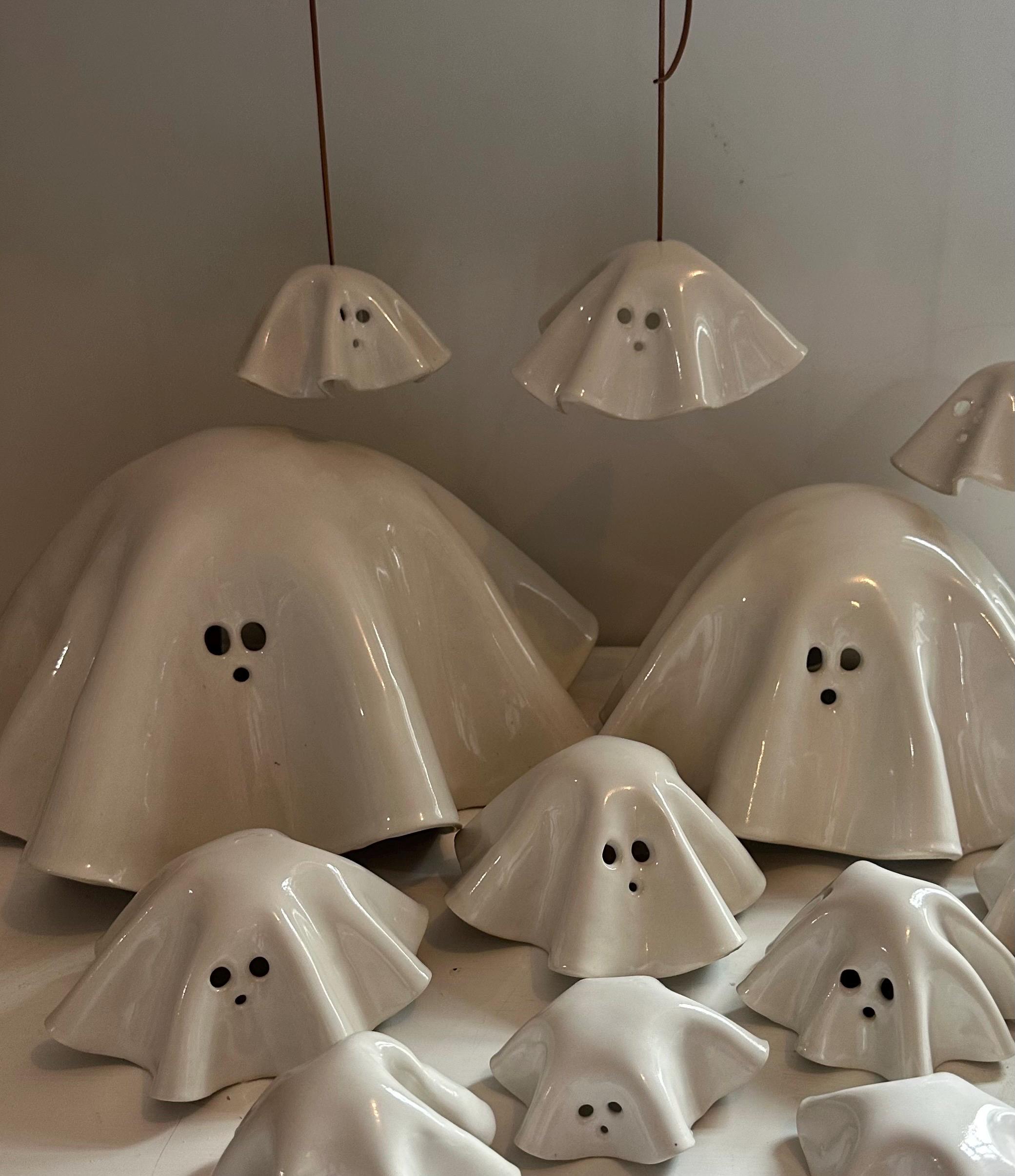 Ceramic hand-made and hand painted white Halloween ghosts